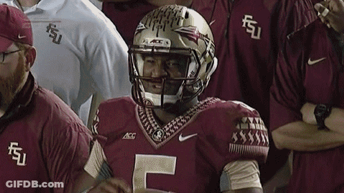 A Football Player Wearing A Helmet With The Letter F On It GIF