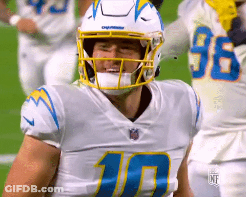 A Football Player Wearing A Helmet With The Number 10 On His Jersey GIF