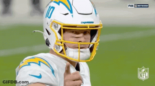 A Football Player Wearing A Helmet With The Number 10 On It GIF