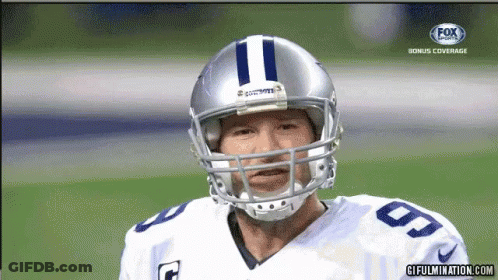 A Football Player Wearing A Helmet With The Number 11 On The Front GIF
