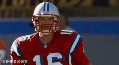 A Football Player Wearing A Helmet With The Number 16 On It GIF