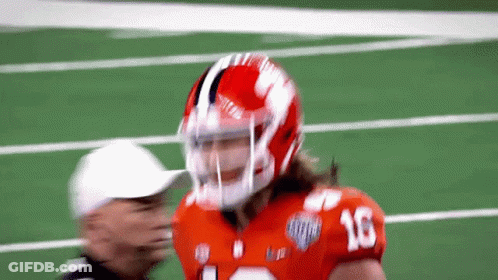 A Football Player Wearing A Helmet With The Number 16 On The Front GIF