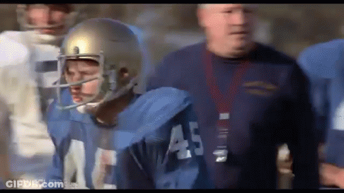 A Football Player Wearing A Helmet With The Number 45 On It GIF