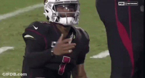 A Football Player Wearing A Helmet With The Number 7 On The Front GIF