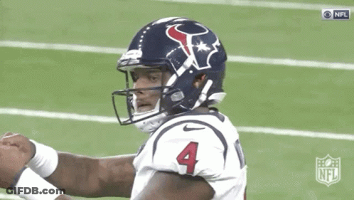 A Football Player Wearing A Helmet With The Number Four On It GIF