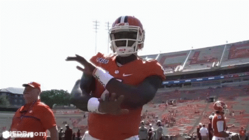 A Football Player Wearing A Jersey That Says Clemson Is Dancing GIF