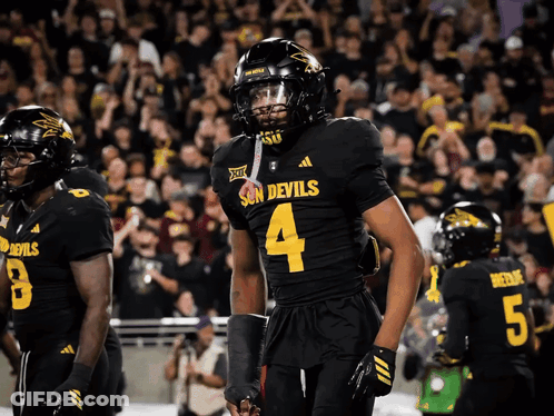 A Football Player Wearing A Jersey That Says Devils On It GIF