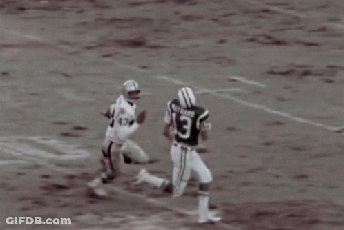 A Football Player Wearing A Jersey With The Number 12 On It GIF