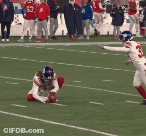 A Football Player Wearing A Jersey With The Number 33 On It GIF