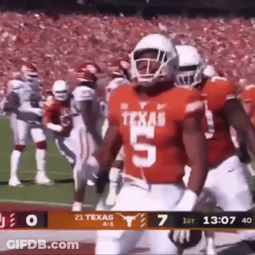 A Football Player Wearing A Jersey With The Number 5 On It Is Running On The Field . GIF