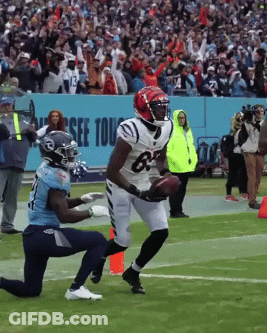 A Football Player Wearing A Jersey With The Number 63 On It GIF