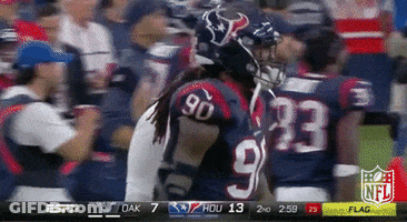 A Football Player Wearing A Jersey With The Number 90 On It GIF