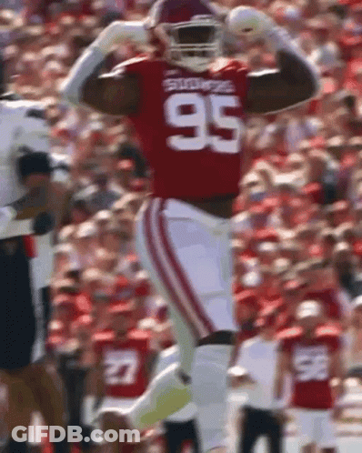 A Football Player Wearing A Jersey With The Number 95 On It GIF