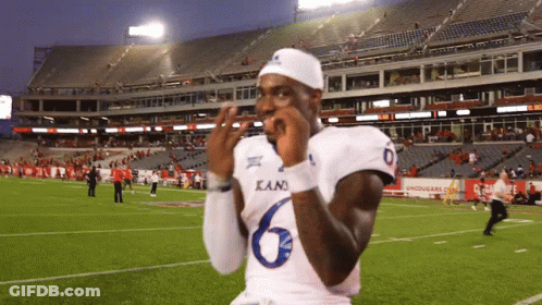 A Football Player Wearing A Kani Jersey Is Standing On The Field GIF