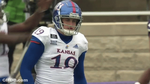 A Football Player Wearing A Kansas Jersey With The Number 19 On It GIF