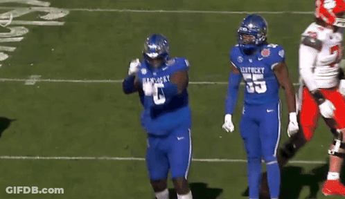 A Football Player Wearing A Kentucky Jersey With The Number 8 On It GIF