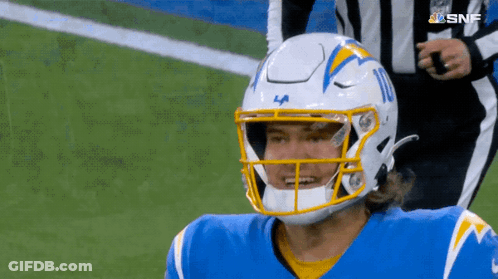 A Football Player Wearing A La Helmet Stands On The Field GIF