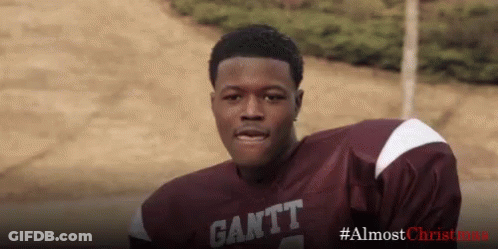 A Football Player Wearing A Maroon And White Jersey With The Word Gantt On It . GIF