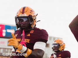 A Football Player Wearing A Maroon Jersey That Says Arizona State On It GIF