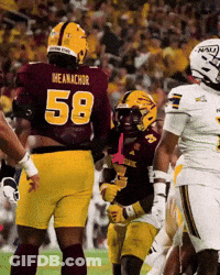 A Football Player Wearing A Maroon Jersey With The Number 58 On The Back GIF