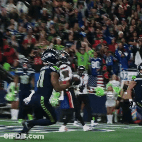 A Football Player Wearing A Number 1 Jersey Is Running On The Field GIF