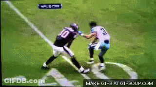 A Football Player Wearing A Number 10 Jersey Is Fighting Another Player GIF