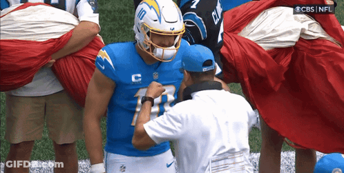 A Football Player Wearing A Number 10 Jersey GIF