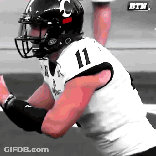 A Football Player Wearing A Number 11 Jersey GIF