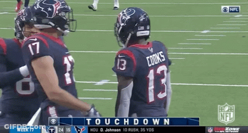 A Football Player Wearing A Number 13 Jersey Talks To Another Player On The Field GIF