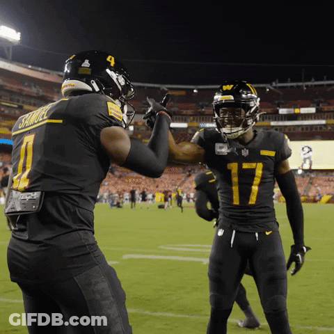 A Football Player Wearing A Number 17 Jersey High Fives Another Player Wearing A Number 4 Jersey GIF