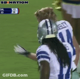 A Football Player Wearing A Number 21 Jersey Stands On The Field GIF