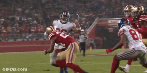 A Football Player Wearing A Number 26 Jersey Runs With The Ball GIF