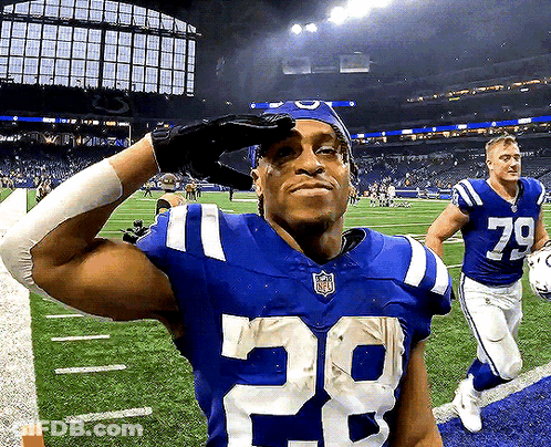 A Football Player Wearing A Number 29 Jersey Salutes GIF