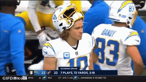 A Football Player Wearing A Number 33 Jersey GIF