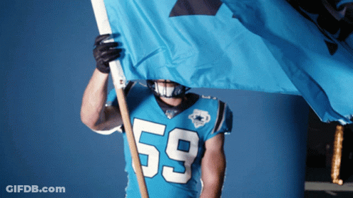 A Football Player Wearing A Number 59 Jersey Holds A Blue Flag GIF
