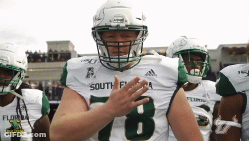 A Football Player Wearing A Number 78 Jersey Applauds GIF