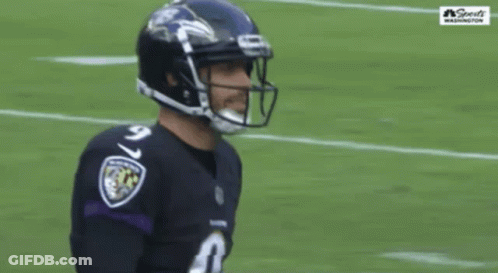 A Football Player Wearing A Number 9 Jersey Stands On The Field GIF