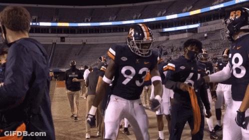 A Football Player Wearing A Number 93 Jersey GIF