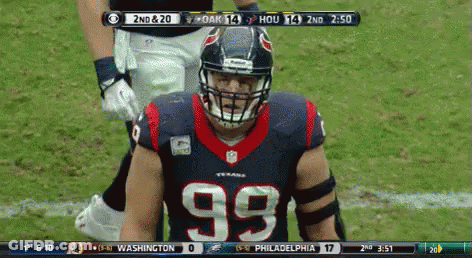 A Football Player Wearing A Number 99 Jersey Stands On The Field GIF