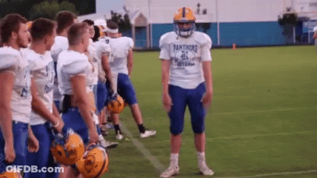 A Football Player Wearing A Panthers Jersey Stands On The Field GIF