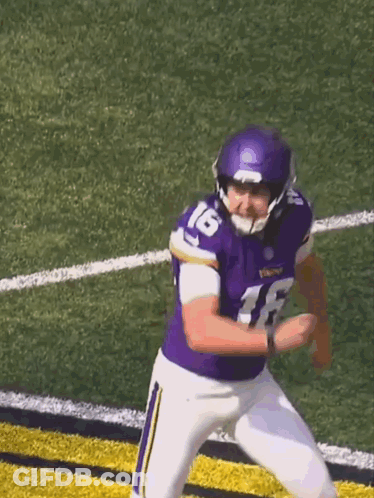 A Football Player Wearing A Purple Jersey With The Number 16 On It GIF