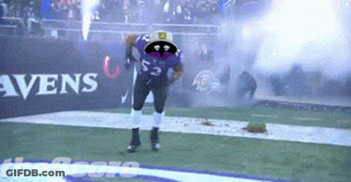 A Football Player Wearing A Purple Jersey With The Number 22 On It GIF