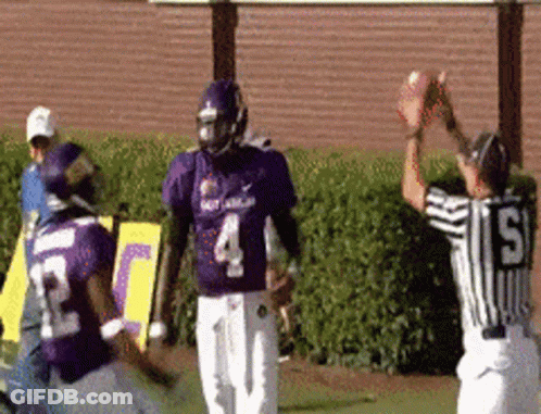 A Football Player Wearing A Purple Jersey With The Number 4 GIF