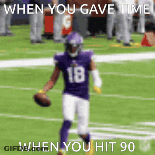 A Football Player Wearing A Purple Uniform With The Number 18 On It GIF