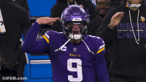 A Football Player Wearing A Purple Vikings Helmet And Jersey GIF