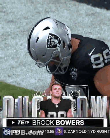A Football Player Wearing A Raiders Helmet Is On The Field GIF