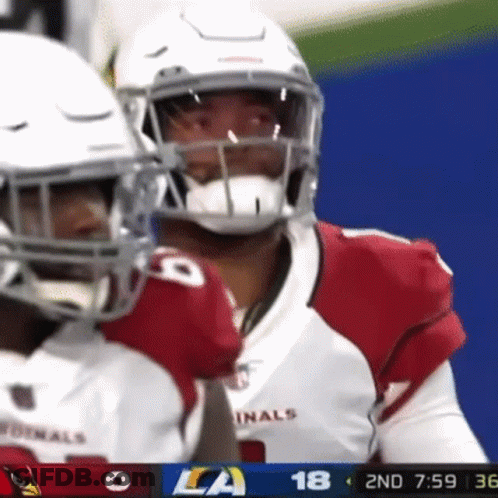 A Football Player Wearing A Red And White Uniform With The Number 18 On It GIF