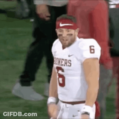 A Football Player Wearing A Red Headband And A White Jersey With The Number 6 On It . GIF
