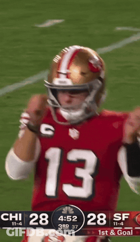 A Football Player Wearing A Red Jersey With The Number 13 GIF