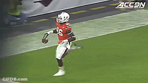 A Football Player Wearing A Red Jersey With The Number 26 On It GIF